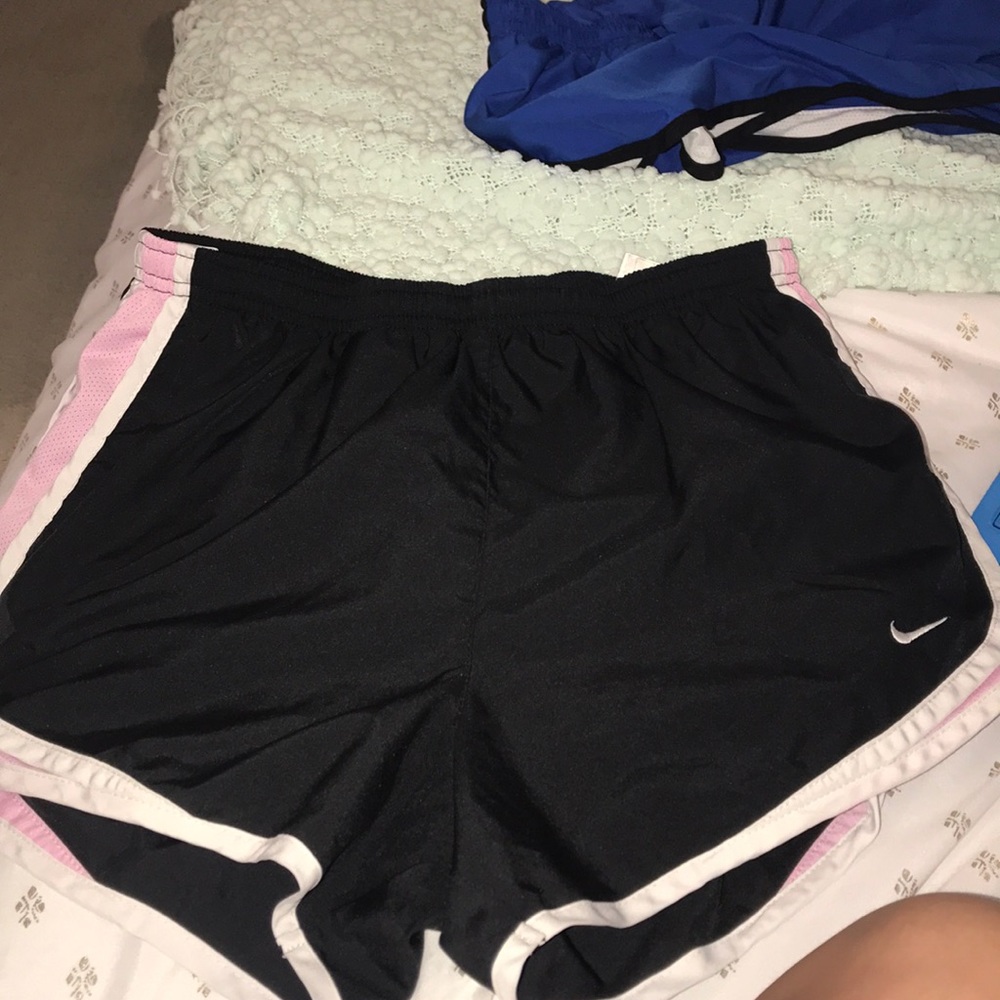 Black, pink, and white nike Dri-fit shorts